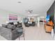 Spacious living room with gray sofas, modern decor, and an open floor plan, perfect for entertaining at 6741 Rookery Lake Dr, Bradenton, FL 34212