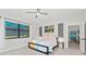 Spacious bedroom with a queen bed and large window at 6741 Rookery Lake Dr, Bradenton, FL 34212