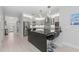 Modern kitchen with an island and stainless steel appliances at 6741 Rookery Lake Dr, Bradenton, FL 34212