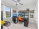 This home office boasts ample storage, a built-in desk, and an ergonomic orange chair at 6741 Rookery Lake Dr, Bradenton, FL 34212