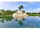 Community entrance sign with reflective pond at 6741 Rookery Lake Dr, Bradenton, FL 34212