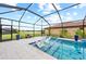 Beautiful screened pool with in-pool seating and a spacious deck, perfect for outdoor enjoyment at 6741 Rookery Lake Dr, Bradenton, FL 34212