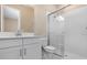 Contemporary bathroom featuring white cabinets, sleek fixtures, and a modern glass shower at 7661 Moonbeam Ave, Sarasota, FL 34241