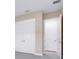 Spacious bedroom with closet featuring white doors and access to the en suite bathroom at 7661 Moonbeam Ave, Sarasota, FL 34241
