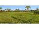 Expansive dog park with fenced area and playground in background at 7661 Moonbeam Ave, Sarasota, FL 34241