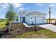 Beautiful new home construction featuring a brick paver driveway and two-car garage at 7661 Moonbeam Ave, Sarasota, FL 34241