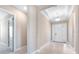 Inviting foyer with light hardwood floors and a large front door entrance at 7661 Moonbeam Ave, Sarasota, FL 34241