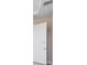 Hallway with a white door and neutral wall color at 7661 Moonbeam Ave, Sarasota, FL 34241