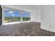 Enclosed lanai with brick flooring provides relaxing views of the pool and backyard at 7661 Moonbeam Ave, Sarasota, FL 34241
