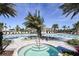 Stunning pool area with a spa, tropical landscaping, and comfortable lounge chairs for ultimate relaxation at 7661 Moonbeam Ave, Sarasota, FL 34241