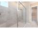 Modern bathroom showcasing a glass-enclosed shower with gray tiling and contemporary fixtures at 7661 Moonbeam Ave, Sarasota, FL 34241