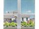 Residential street view through the window featuring new home construction at 7661 Moonbeam Ave, Sarasota, FL 34241