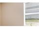 Bright view from the window with closed blinds and showing a neighborhood street at 7661 Moonbeam Ave, Sarasota, FL 34241