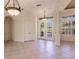 Bright dining room with tiled floors and elegant chandelier at 22575 Morning Glory Cir, Bradenton, FL 34202