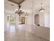 Bright dining room with tiled floors and elegant chandelier at 22575 Morning Glory Cir, Bradenton, FL 34202