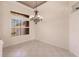 Bright dining room with tiled floors and elegant chandelier at 22575 Morning Glory Cir, Bradenton, FL 34202
