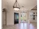 Bright dining room with tiled floors and elegant chandelier at 22575 Morning Glory Cir, Bradenton, FL 34202