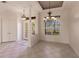 Bright dining room with tiled floors and elegant chandelier at 22575 Morning Glory Cir, Bradenton, FL 34202