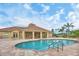 Inviting community pool with plenty of lounge chairs for relaxation and recreation at 2921 Seasons Blvd, Sarasota, FL 34240