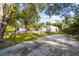 Large backyard with detached garage and mature trees at 5404 Carso Ter, North Port, FL 34286