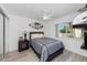 Comfortable bedroom with ceiling fan and built-in shelving at 2209 Belleair Rd # C29, Clearwater, FL 33764