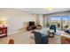 Comfortable living room with ample seating and large windows at 157 Tampa Ave # 707, Venice, FL 34285