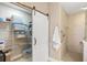 Well-organized storage room with shelving and barn door at 157 Tampa Ave # 707, Venice, FL 34285