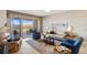 Bright living room with large windows and comfy seating at 157 Tampa Ave # 707, Venice, FL 34285