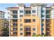 Exterior view of a luxury condo building with balconies and water access at 157 Tampa Ave # 707, Venice, FL 34285