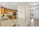 Condo kitchen with granite countertops and wood cabinets at 157 Tampa Ave # 707, Venice, FL 34285
