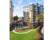 Condominium building with pool and lush landscaping at 157 Tampa Ave # 707, Venice, FL 34285