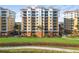 Residential building with a Mediterranean style and lush landscaping at 157 Tampa Ave # 707, Venice, FL 34285