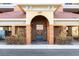 Condo building entrance with secure gate and elevator access at 157 Tampa Ave # 707, Venice, FL 34285