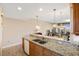 Modern kitchen features granite countertops and double sink at 157 Tampa Ave # 707, Venice, FL 34285