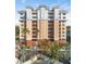 Condo building with balconies and a terracotta roof at 157 Tampa Ave # 707, Venice, FL 34285