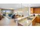 Open kitchen with granite countertops, stainless steel appliances, and breakfast bar at 157 Tampa Ave # 707, Venice, FL 34285