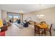 Spacious living room with access to a balcony and scenic views at 157 Tampa Ave # 707, Venice, FL 34285