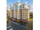 Elegant multi-story building with a light-colored facade and balconies at 157 Tampa Ave # 707, Venice, FL 34285
