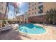 Inviting community pool with lounge chairs and landscaping at 157 Tampa Ave # 707, Venice, FL 34285