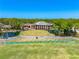 Aerial view of golf course clubhouse and driving range at 3523 Longmeadow # 12, Sarasota, FL 34235