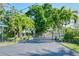 Gated entrance to community with palm trees at 6724 Schooner Bay Cir # 6724, Sarasota, FL 34231