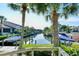 Scenic waterfront view with boats docked and lush tropical landscaping at 6724 Schooner Bay Cir # 6724, Sarasota, FL 34231