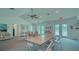 Community room with tables, chairs, and pool view at 7788 Eagle Creek Dr # 7788, Sarasota, FL 34243