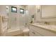 Bathroom featuring a glass-enclosed shower, granite countertop vanity, and modern fixtures at 7928 Matera Ct, Lakewood Ranch, FL 34202