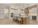 Modern kitchen boasts an island with seating, stainless appliances, and ample cabinet space at 7928 Matera Ct, Lakewood Ranch, FL 34202