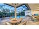 Spacious lanai with a dining table, pool, spa, and comfortable seating, perfect for outdoor entertaining at 7928 Matera Ct, Lakewood Ranch, FL 34202