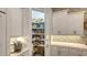 Walk-in pantry with lots of shelves for food storage at 7928 Matera Ct, Lakewood Ranch, FL 34202