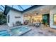 Enjoy outdoor living in this patio with a jacuzzi, comfortable seating, and seamless indoor-outdoor transition at 7928 Matera Ct, Lakewood Ranch, FL 34202