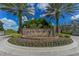 Circular water feature with a brick wall and decorative fountains at 7928 Matera Ct, Lakewood Ranch, FL 34202