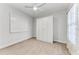 Bright bedroom with ceiling fan, window, and closet at 1269 Backspin Dr, Englewood, FL 34223